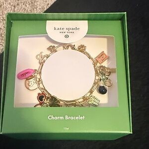 kate spade gold-tone charm bracelet with pink and black accents